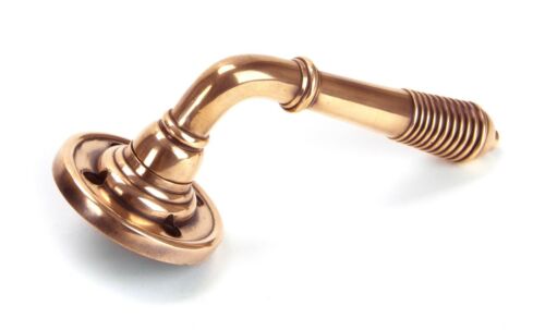 From the Anvil Reeded Lever Door handle on rose Polished Bronze